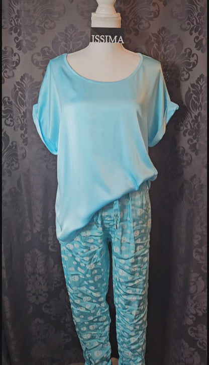 Shiny-Stretchhose, türkis mit Skull, Grösse 42/44 von ISSIMA
